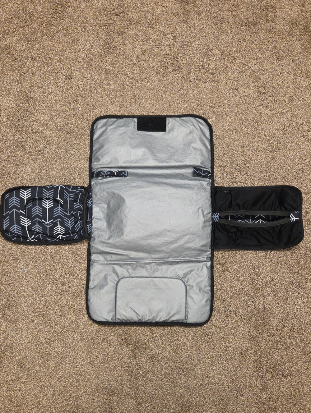 The Carters Black Arrow Fox Baby Mini Diaper Mat & Bag is a stylish and practica